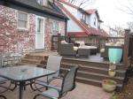 Deck and patio in fenced backyard